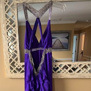 Purple sequin prom dress with open back and ruffle design